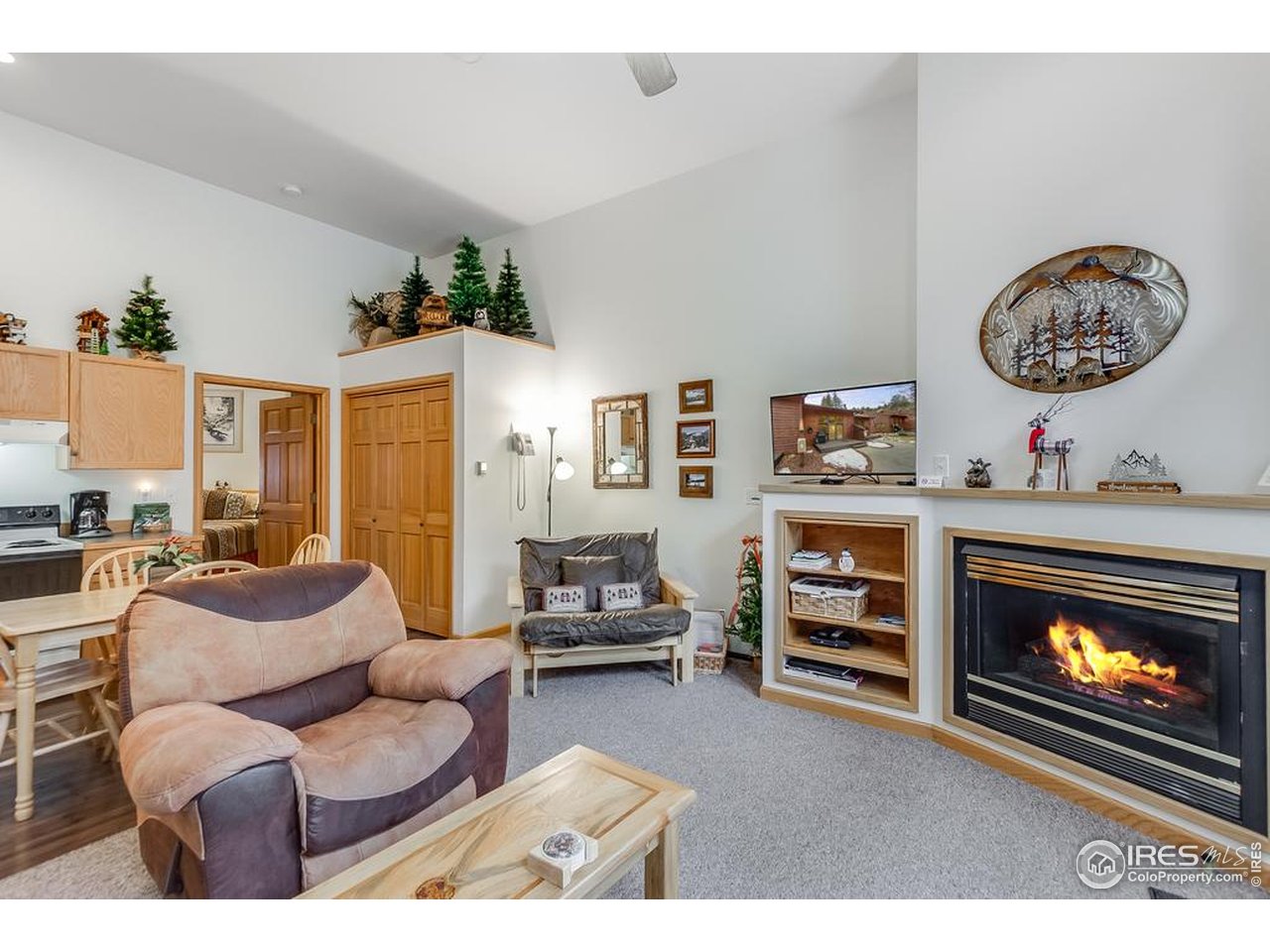 2120 Fall River Road, Unit 2 Estes Park, CO 80517 - Photo 9 of 44 cozy fireplace