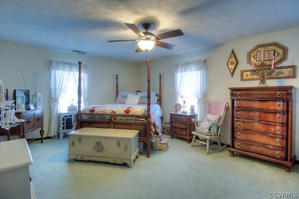 4101 North Courthouse Road Providence Forge, VA 23140 - Photo 20 of 29 a bedroom with a bed and a chandelier