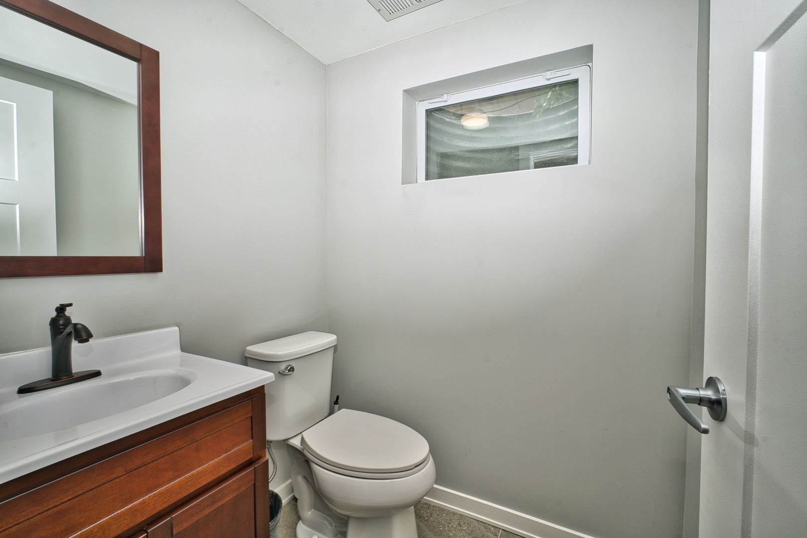 643 Oriole Avenue Park Ridge, IL 60068 - Photo 31 of 31 a bathroom with a toilet sink and mirror
