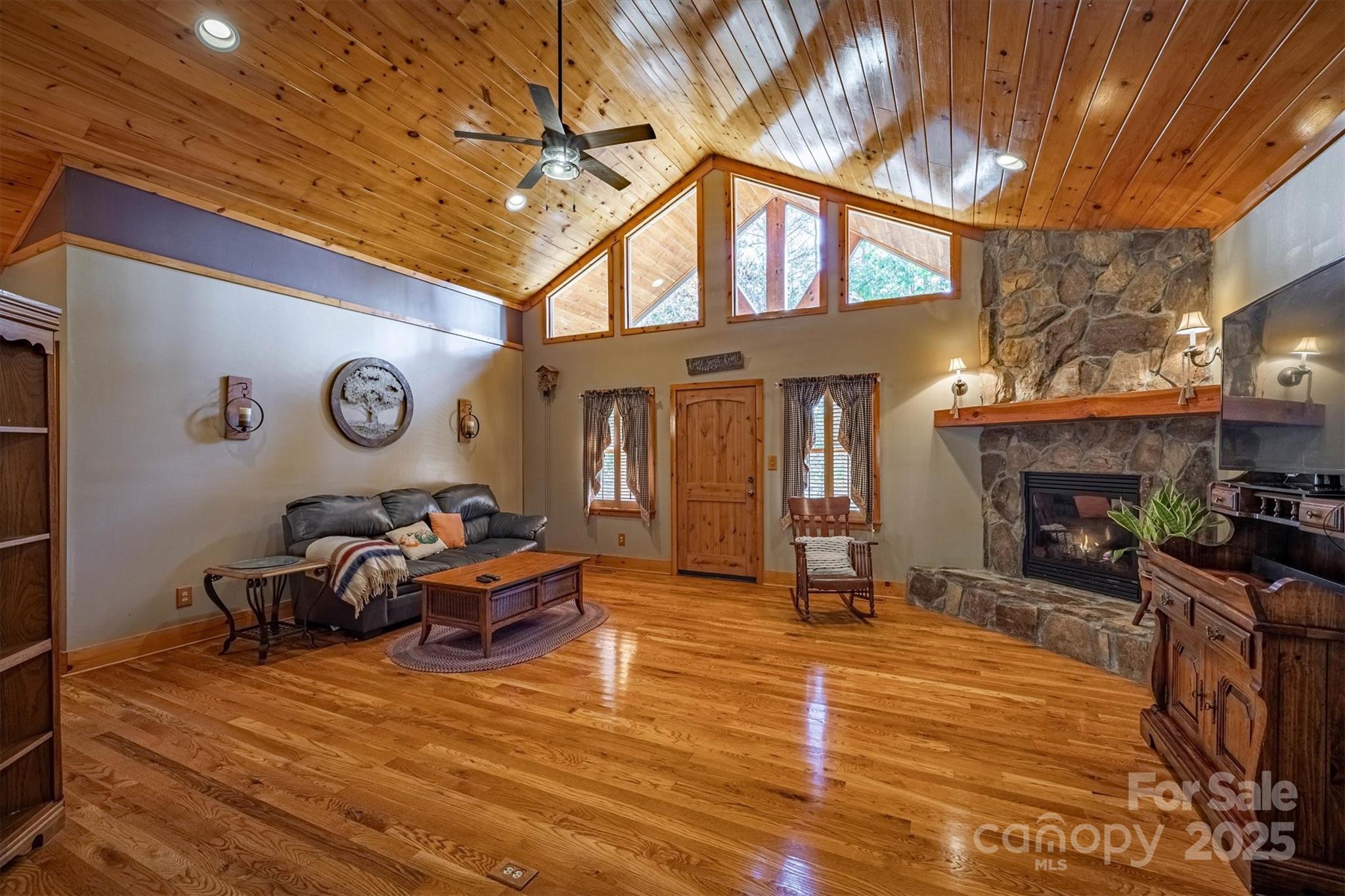 4030 South View Boulevard Morganton, NC 28655 - Photo 11 of 43 a living room with furniture a fireplace and a table
