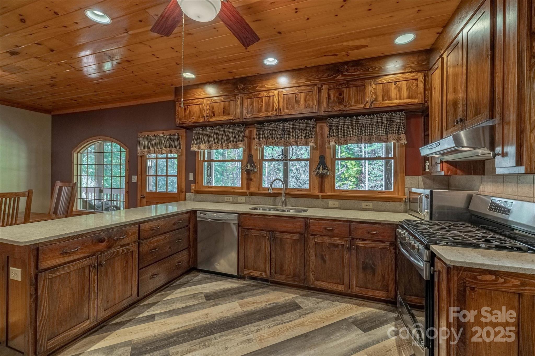4030 South View Boulevard Morganton, NC 28655 - Photo 17 of 43 a large kitchen with stainless steel appliances granite countertop a stove and a sink