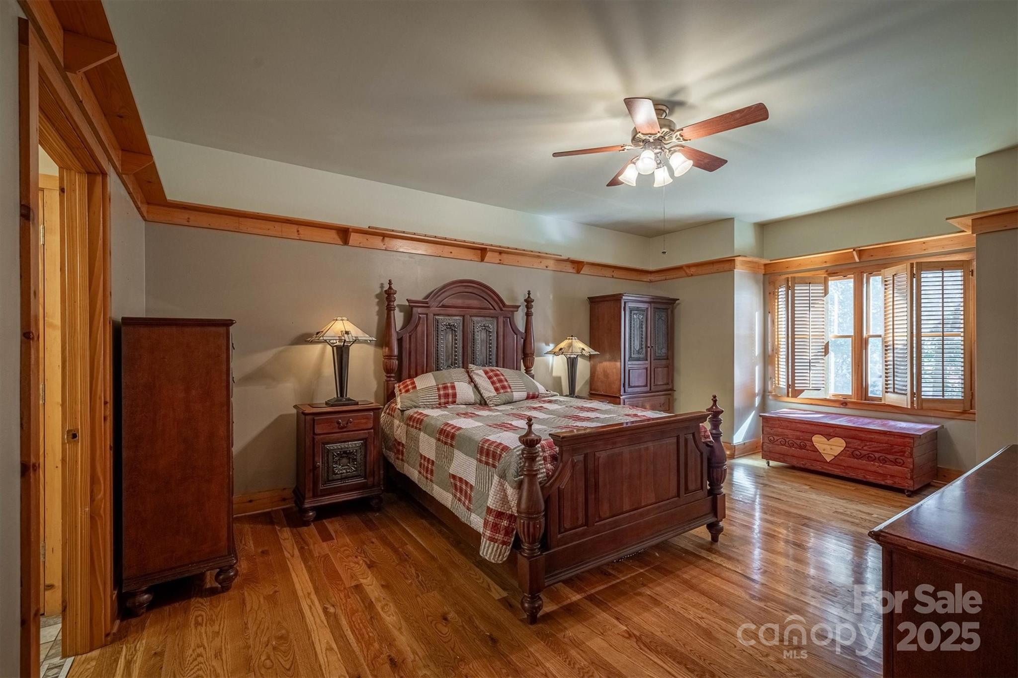 4030 South View Boulevard Morganton, NC 28655 - Photo 18 of 43 a bedroom with a bed and wooden floor