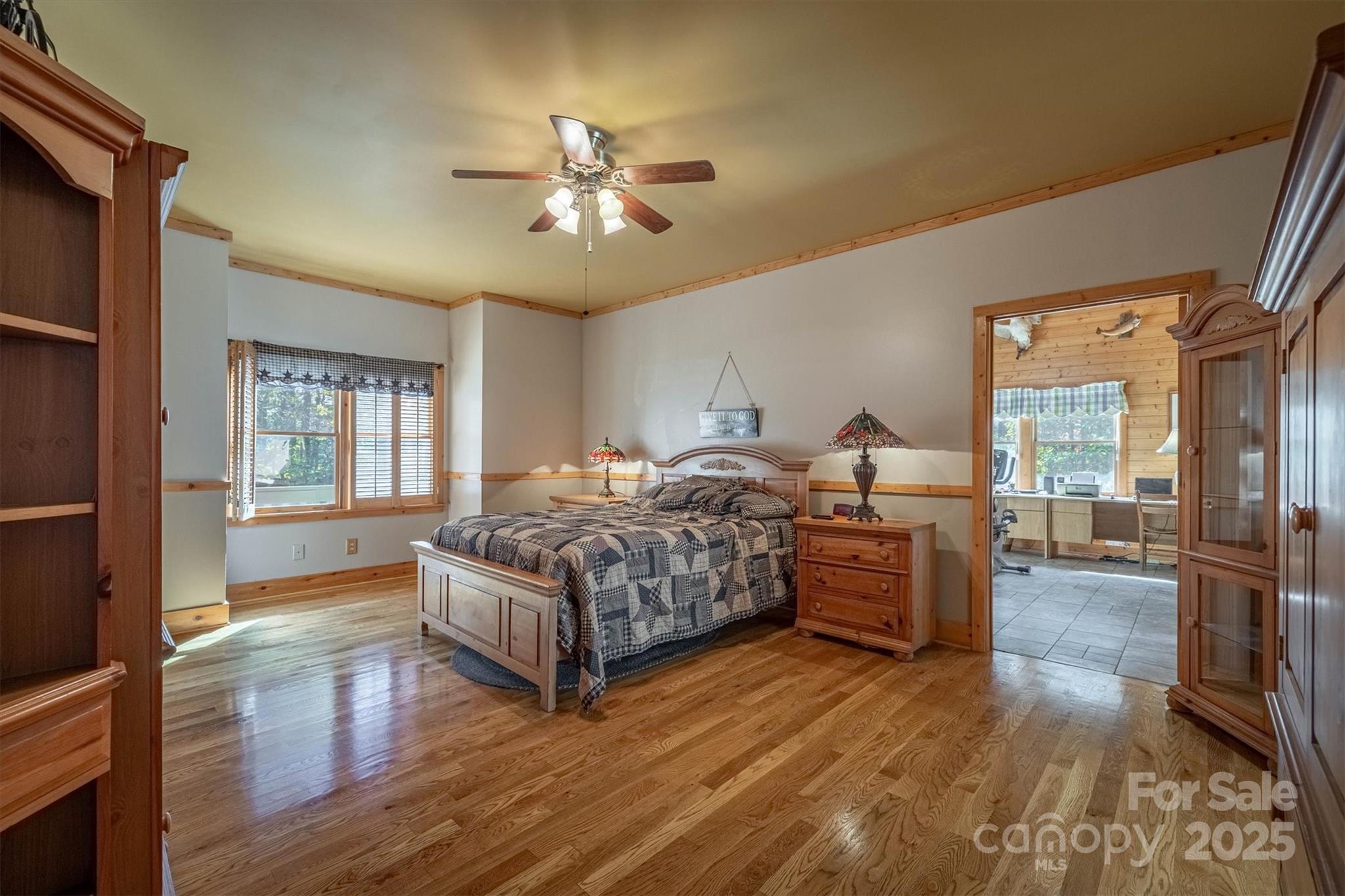 4030 South View Boulevard Morganton, NC 28655 - Photo 22 of 43 a bedroom with a bed and wooden floors