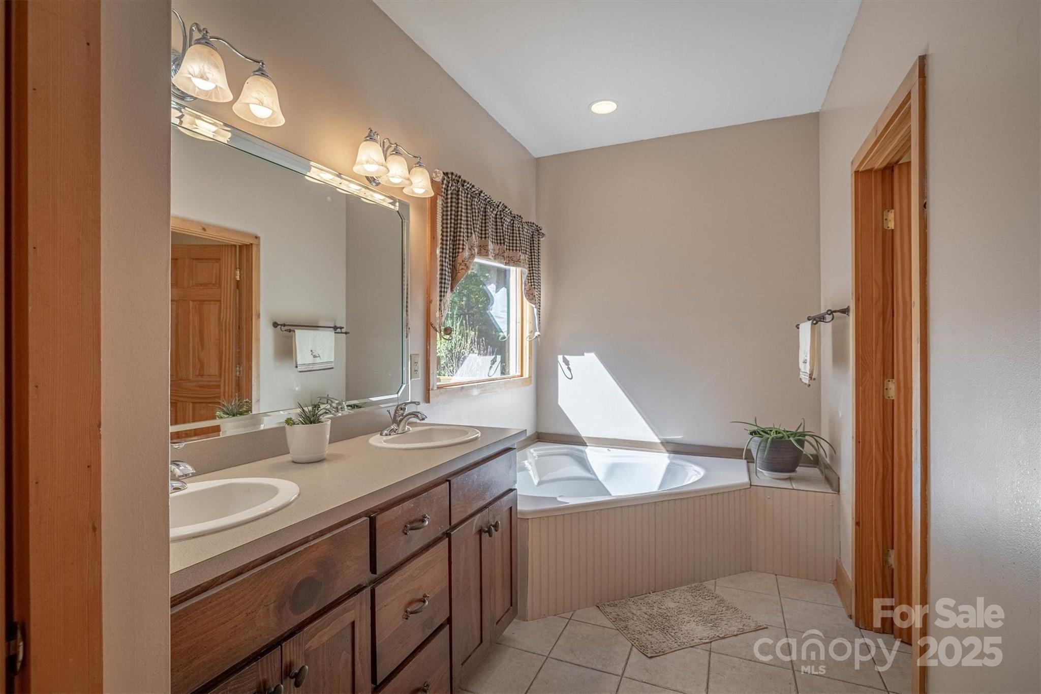 4030 South View Boulevard Morganton, NC 28655 - Photo 24 of 43 a bathroom with a sink a vanity and a mirror