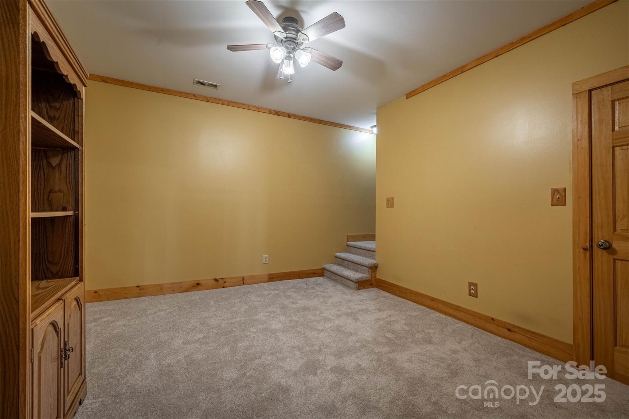 4030 South View Boulevard Morganton, NC 28655 - Photo 30 of 43 an empty room with a ceiling fan and a window