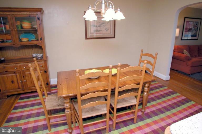 130 Murdock Road Baltimore, MD 21212 - Photo 5 of 16 a bed room with a bed and a chair