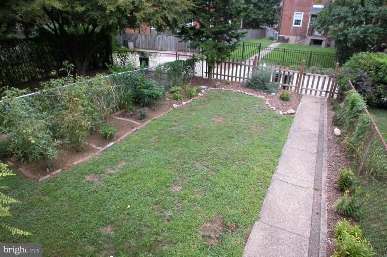130 Murdock Road Baltimore, MD 21212 - Photo 9 of 16 a view of a pathway with a garden