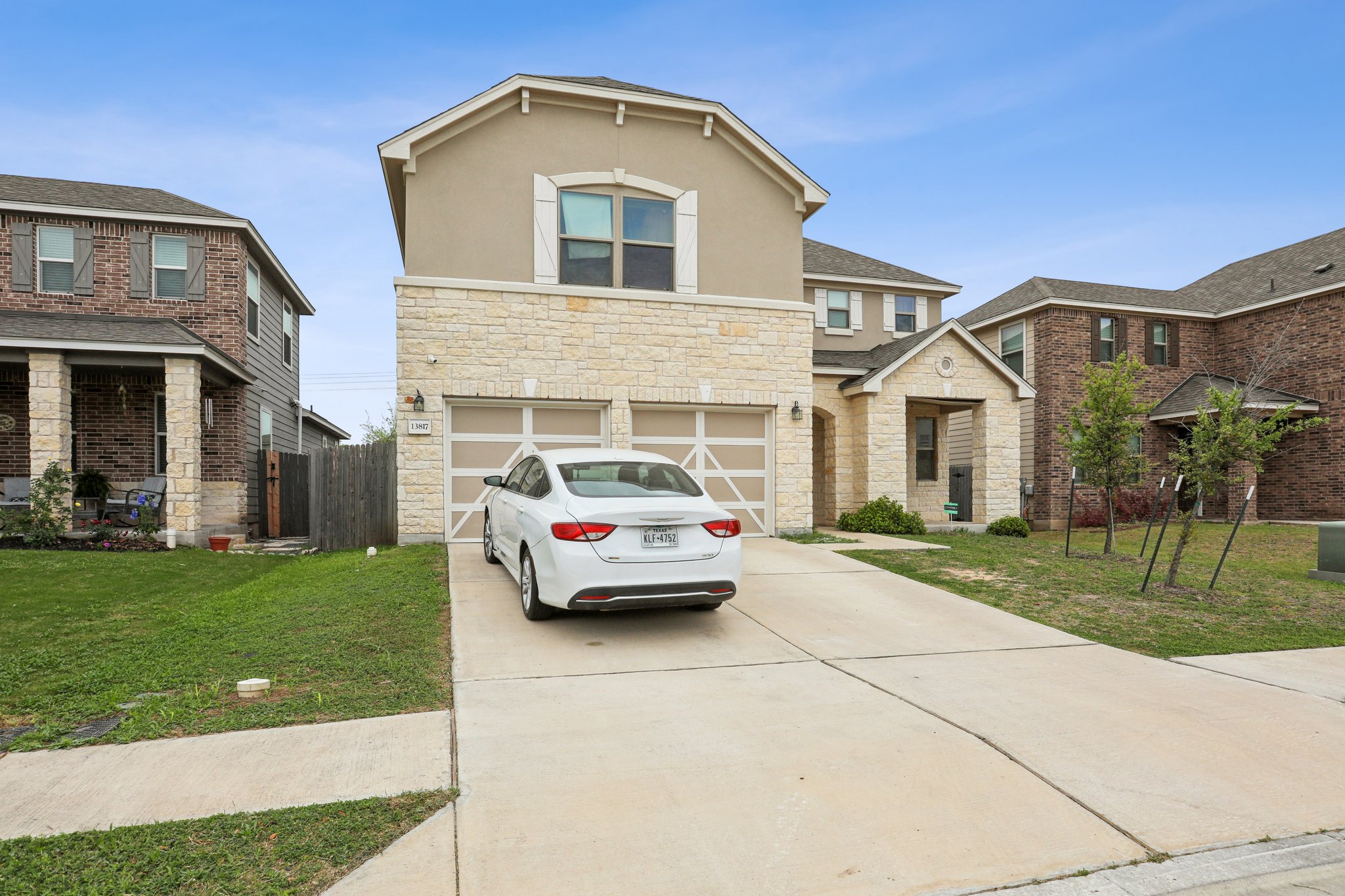13817 Eleanor Roosevelt Street Manor, TX 78653 - Photo 1 of 35 a front view of a house with a yard