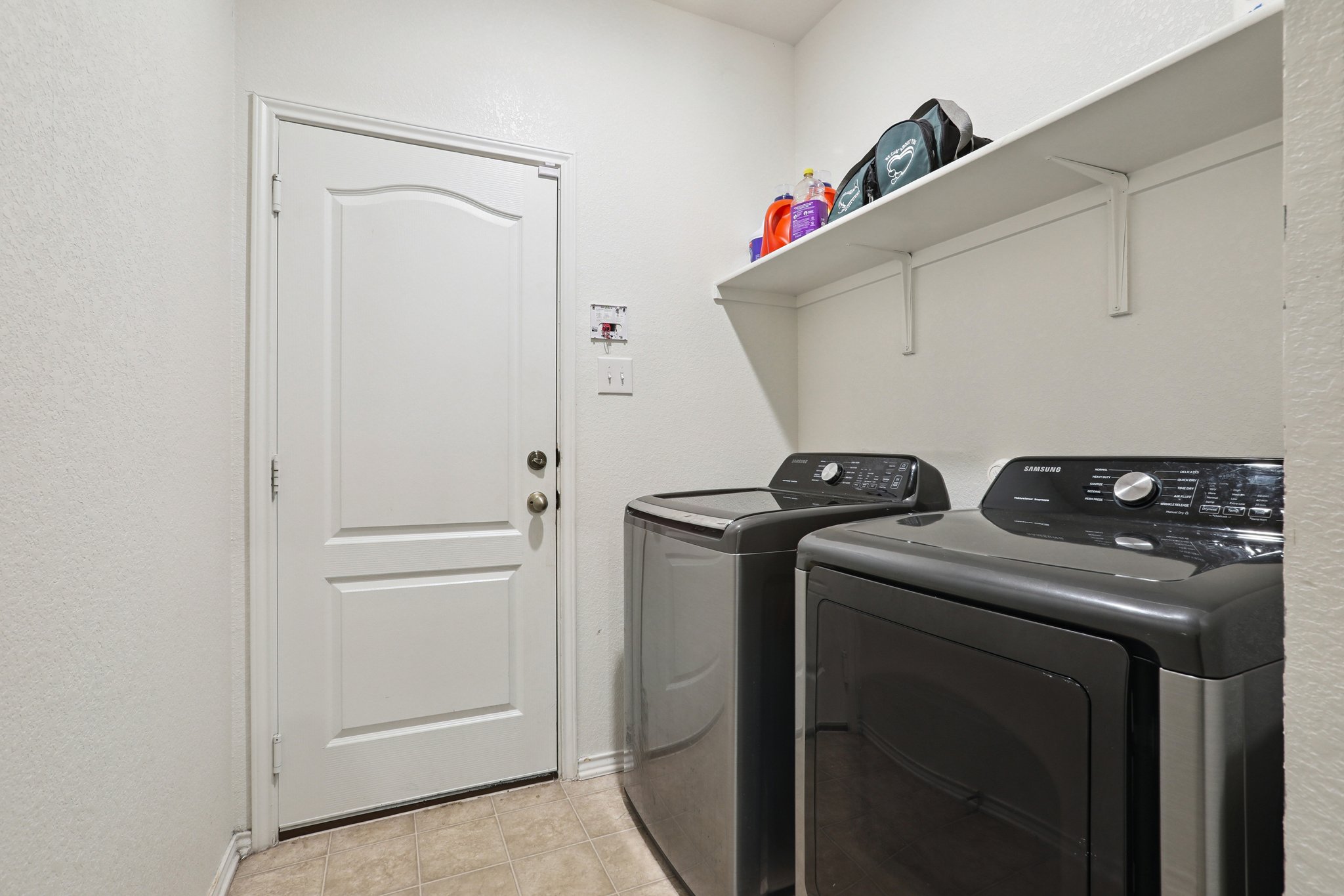 13817 Eleanor Roosevelt Street Manor, TX 78653 - Photo 14 of 35 a utility room with dryer and washer