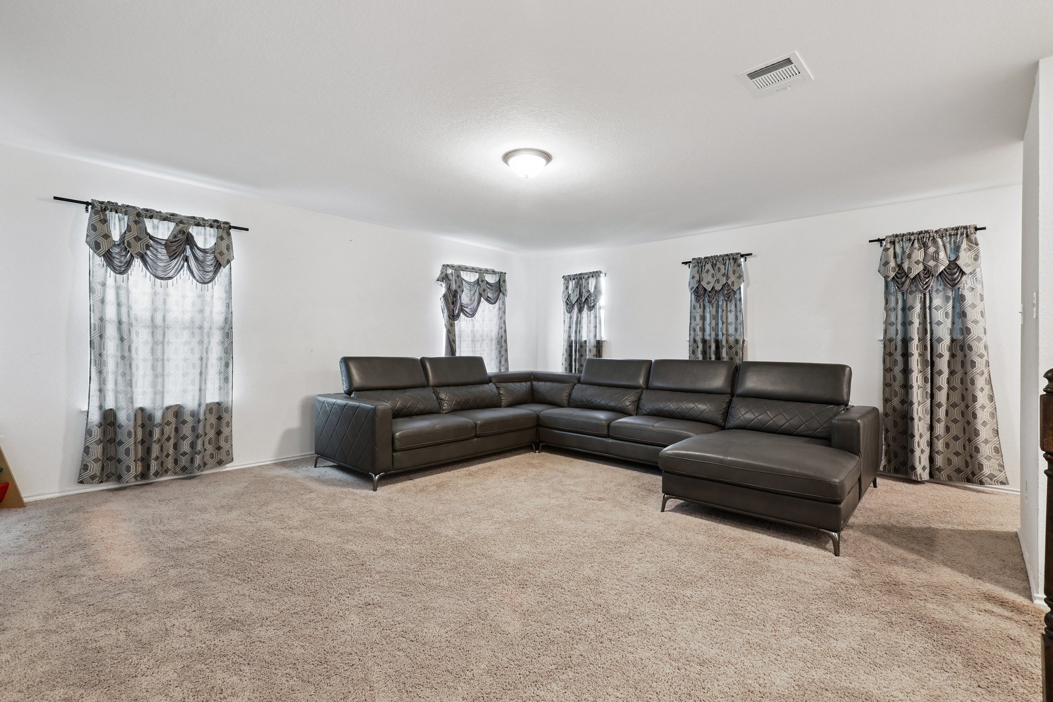 13817 Eleanor Roosevelt Street Manor, TX 78653 - Photo 15 of 35 a living room with furniture and a window