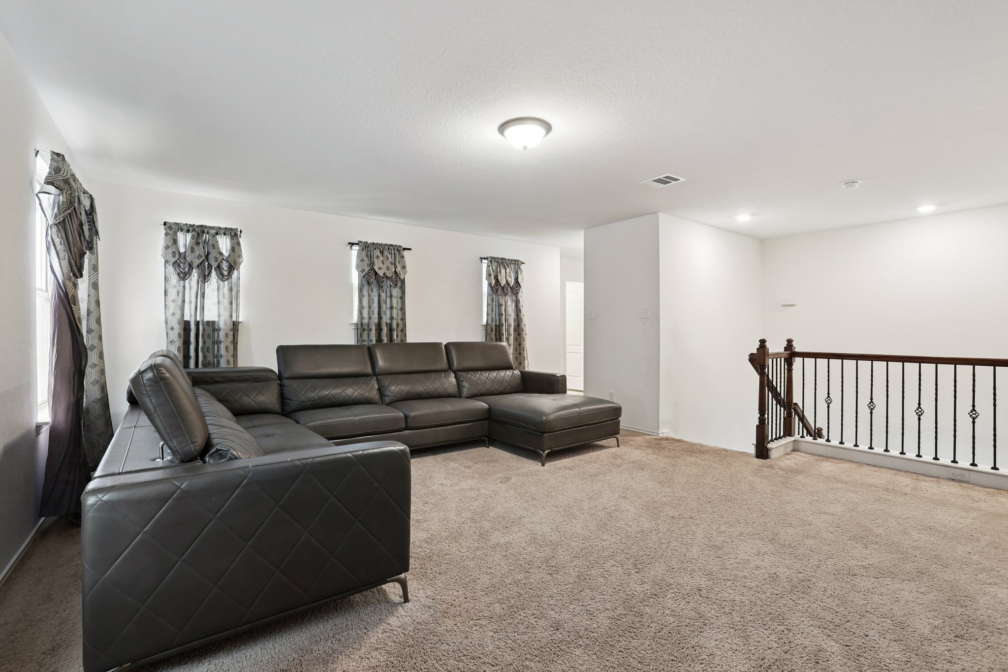 13817 Eleanor Roosevelt Street Manor, TX 78653 - Photo 16 of 35 a living room with furniture and a ceiling fan