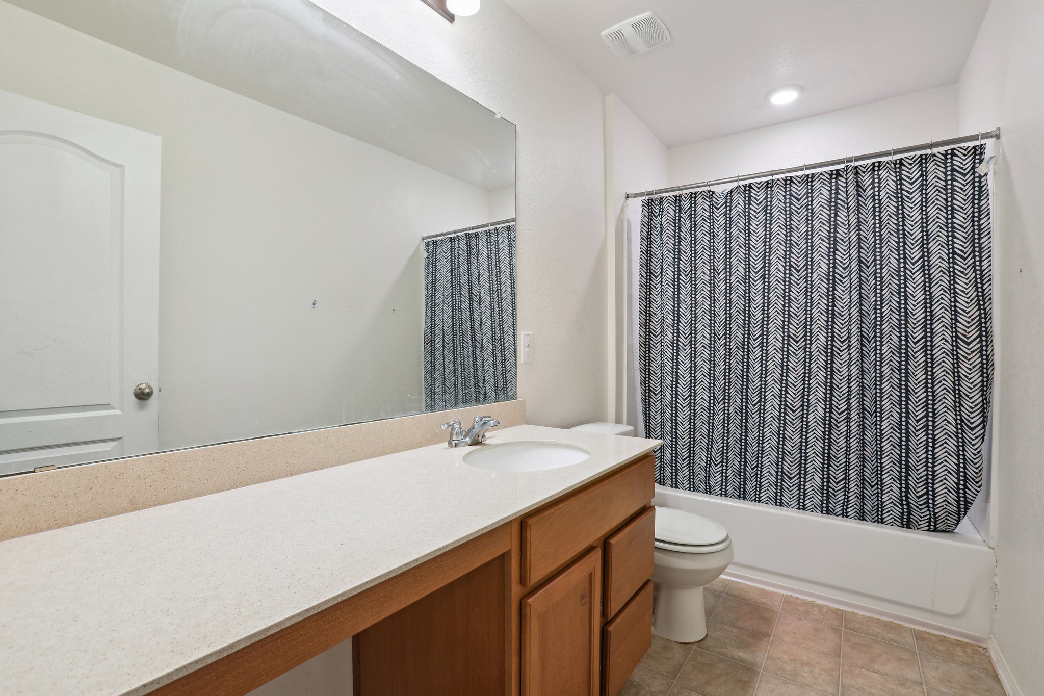 13817 Eleanor Roosevelt Street Manor, TX 78653 - Photo 17 of 35 a bathroom with a sink a toilet and shower