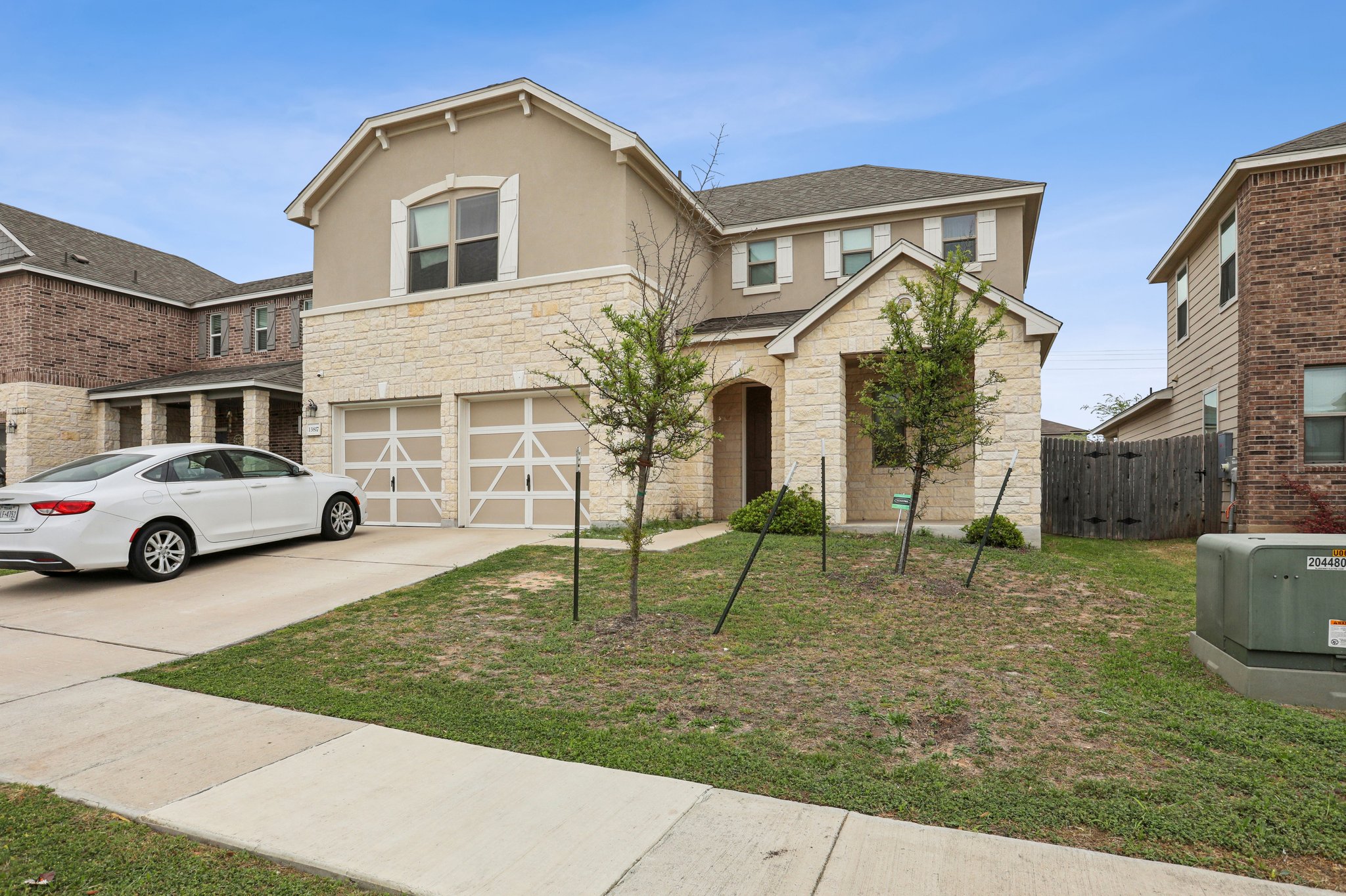 13817 Eleanor Roosevelt Street Manor, TX 78653 - Photo 2 of 35 a view of a white house next to a yard