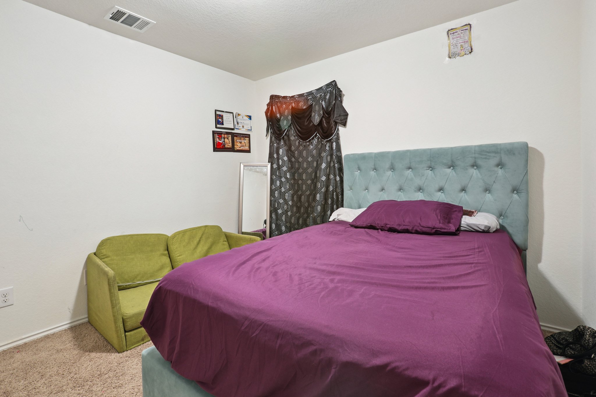 13817 Eleanor Roosevelt Street Manor, TX 78653 - Photo 21 of 35 a bedroom with a bed and a closet