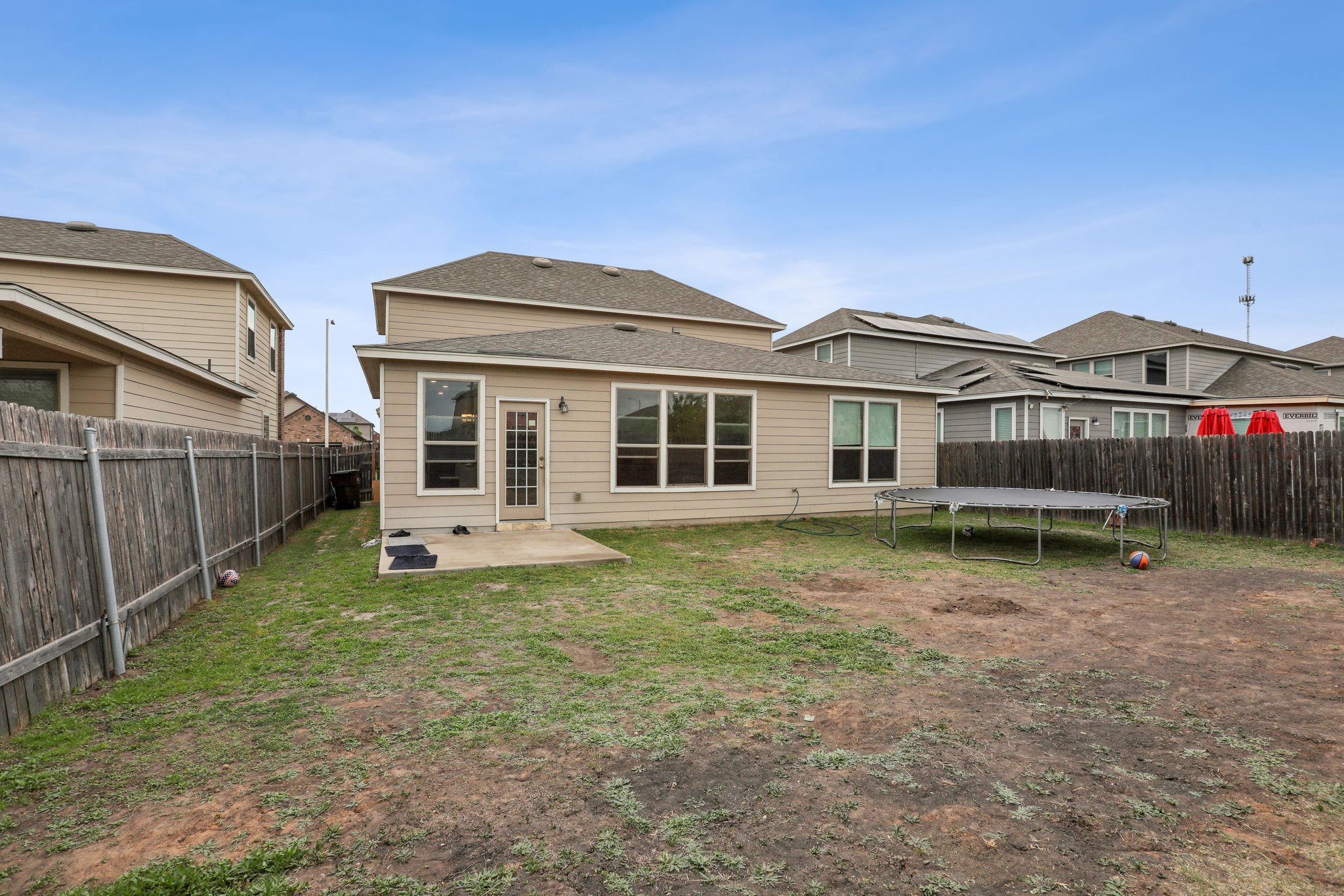 13817 Eleanor Roosevelt Street Manor, TX 78653 - Photo 31 of 35 a view of a house with a yard