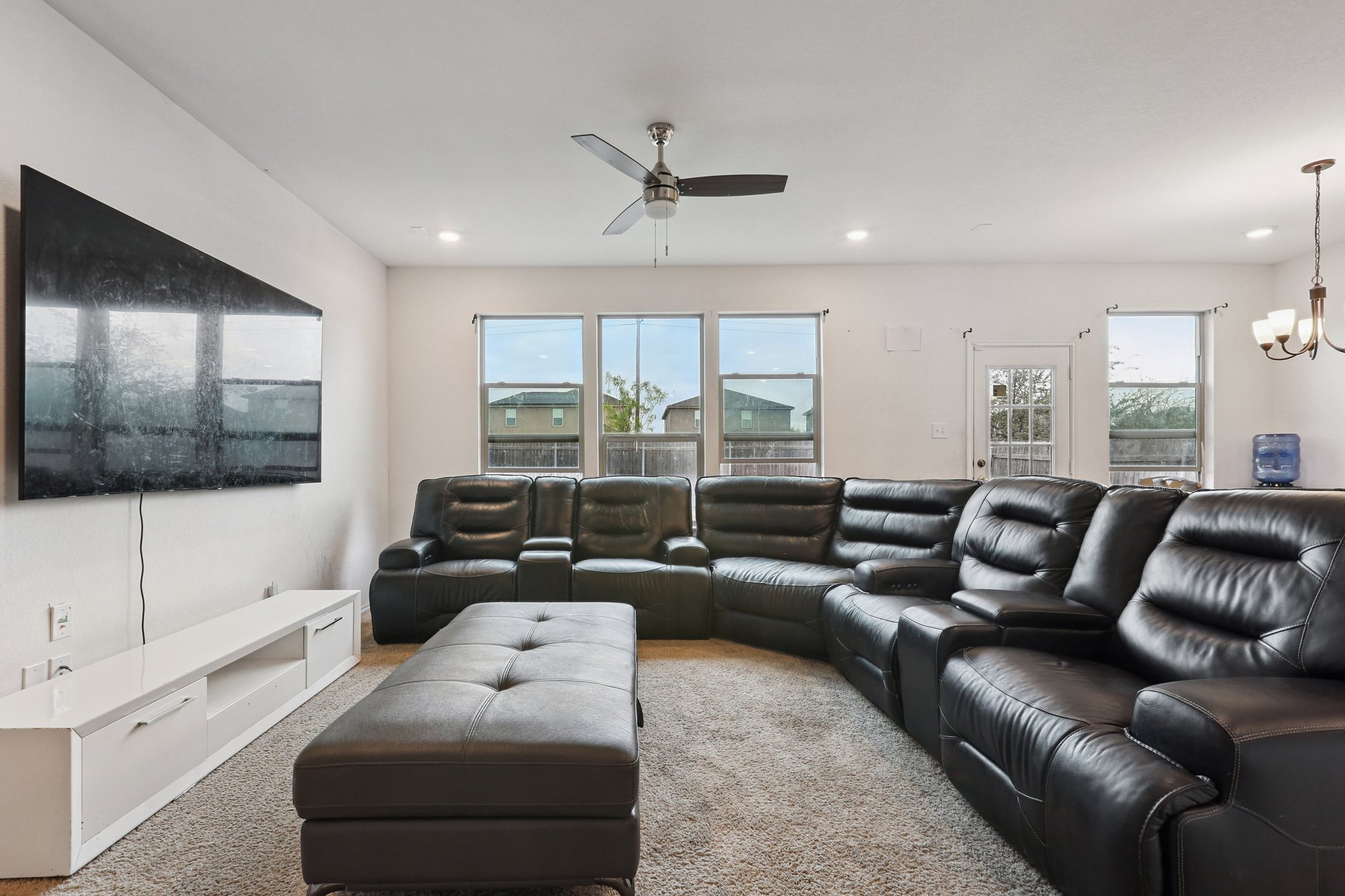 13817 Eleanor Roosevelt Street Manor, TX 78653 - Photo 6 of 35 a living room with furniture and a flat screen tv