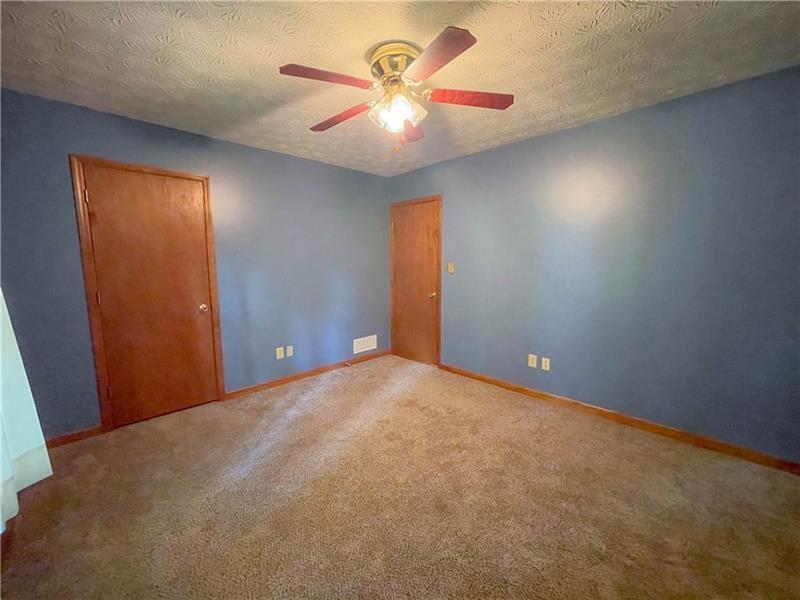 111 Libby Lane Stockbridge, GA 30281 - Photo 18 of 30 a view of an empty room and chandelier fan