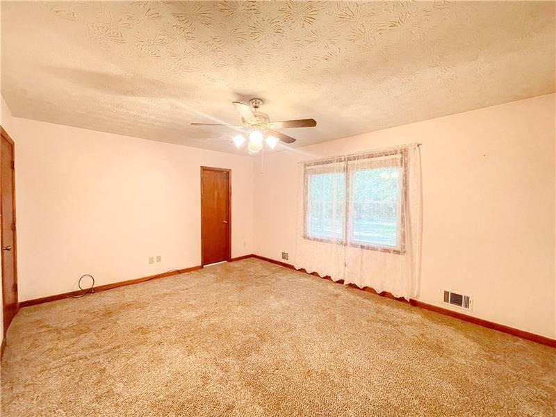111 Libby Lane Stockbridge, GA 30281 - Photo 20 of 30 an empty room with a empty space and windows