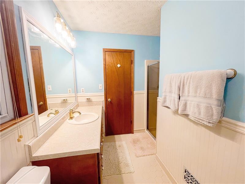 111 Libby Lane Stockbridge, GA 30281 - Photo 22 of 30 a bathroom with a tub sink and mirror