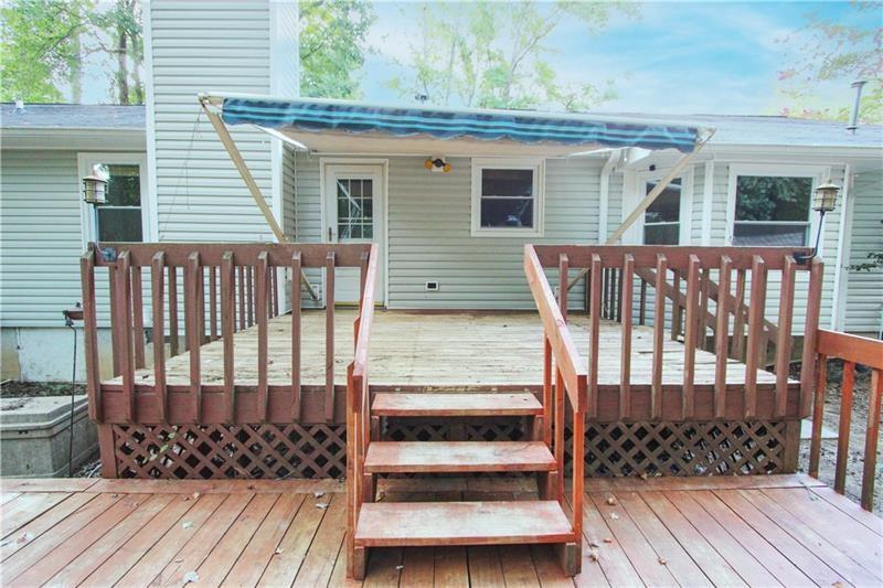 111 Libby Lane Stockbridge, GA 30281 - Photo 23 of 30 a view of a wooden deck front of house