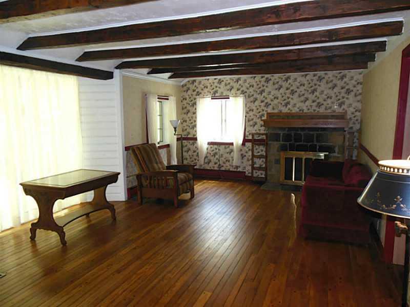 951 Wolfe Road Indiana, PA 15701 - Photo 17 of 25 Living Room. Gorgeous wood burning fire place in corner of living rooms. Sparkling hardwood floors.