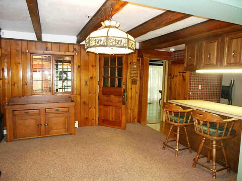 951 Wolfe Road Indiana, PA 15701 - Photo 3 of 25 Dining Room. Country style dining room off of eat in kitchen. Knotty pine walls & beamed ceilings to enhance the country feel.
