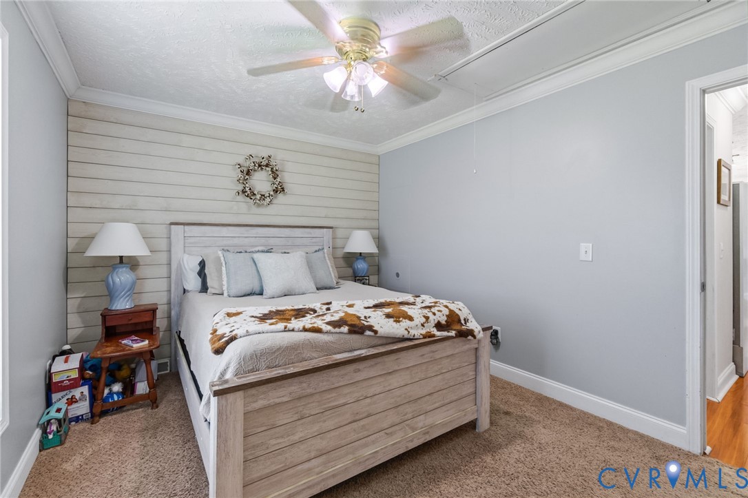 10910 Courthouse Road Dinwiddie, VA 23841 - Photo 13 of 38 Carpeted flooring, crown molding, and a ceiling fa