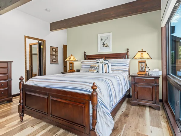 a bedroom with a bed and a dresser