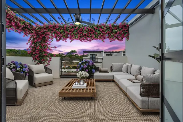 a outdoor living space with furniture and a ceiling fan
