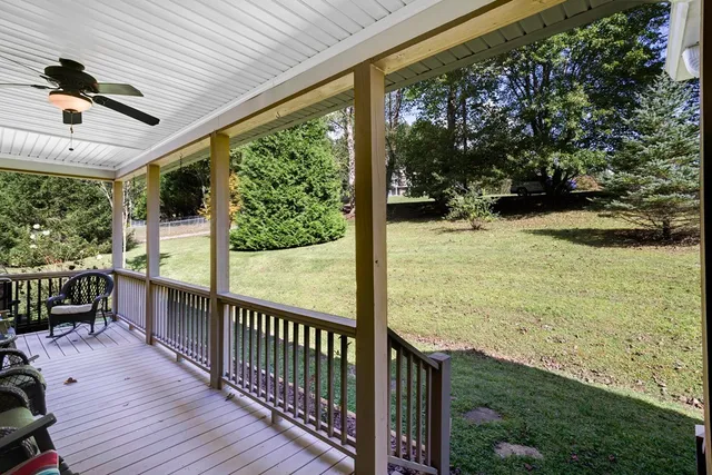 a view of balcony with floor to ceiling windows and wooden floor