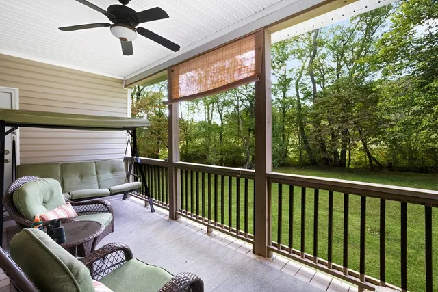 a view of a room with furniture and windows