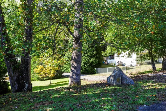 an aerial view of residential house with outdoor space and river view