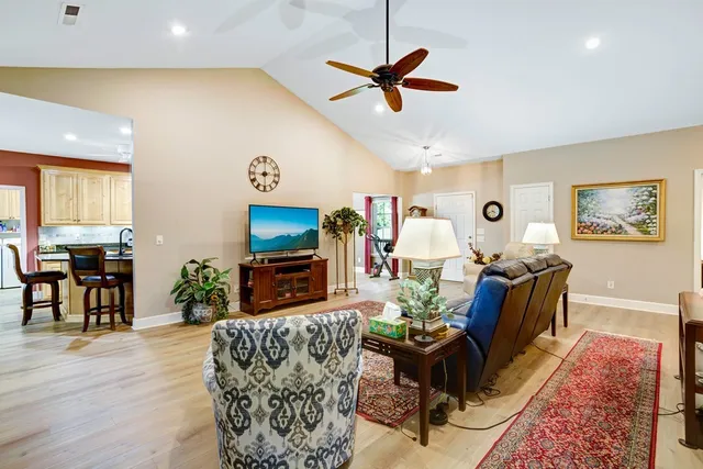 a living room with furniture fireplace and window