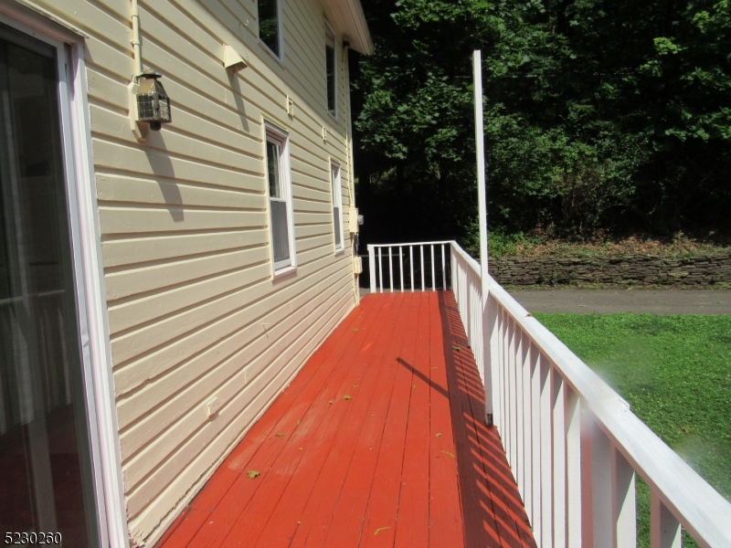 275 Creek Road Frenchtown, NJ 08825 - Photo 15 of 27 a view of balcony with wooden floor and fence