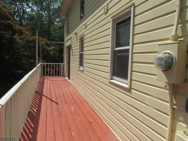 a view of balcony with wooden floor and outdoor space