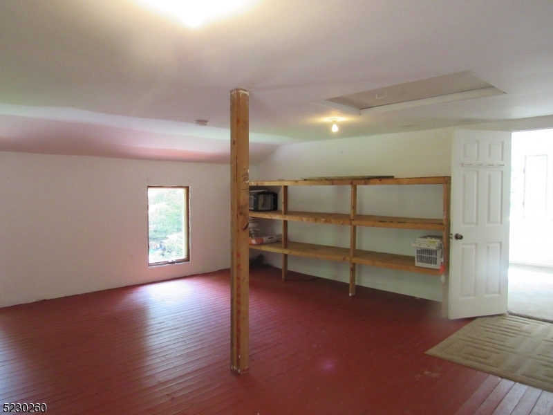 275 Creek Road Frenchtown, NJ 08825 - Photo 17 of 27 an empty room with wooden floor closet and windows