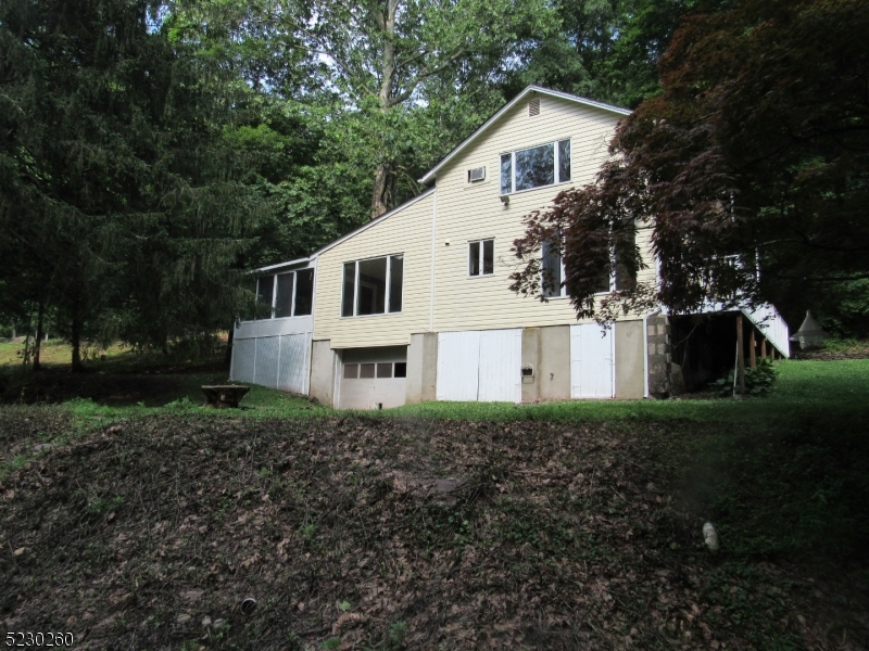 275 Creek Road Frenchtown, NJ 08825 - Photo 21 of 27 a white house with tall trees in the background