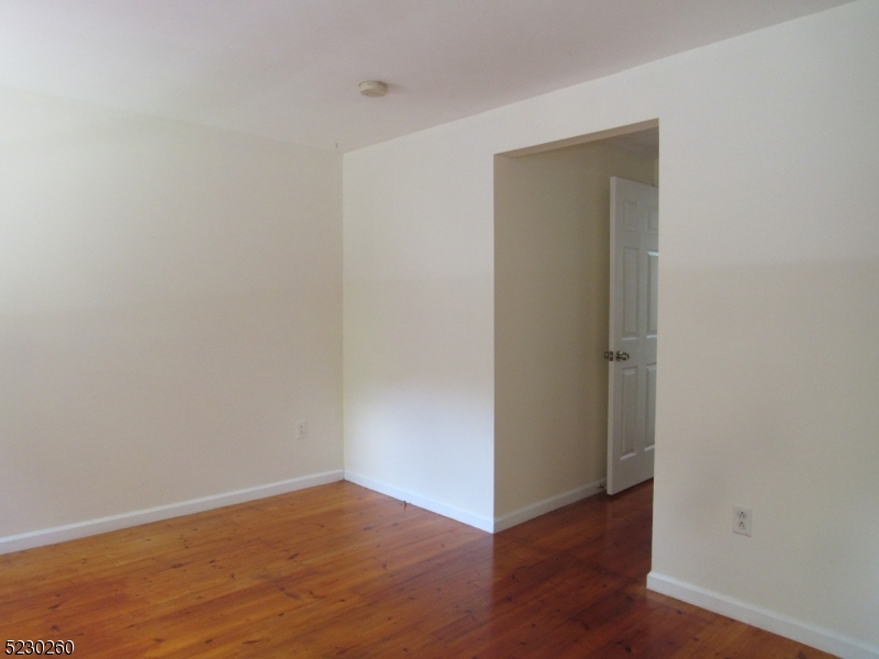 275 Creek Road Frenchtown, NJ 08825 - Photo 5 of 27 a view of an empty room with wooden floor and closet