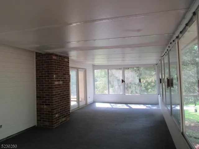 a view of room with floor to ceiling windows