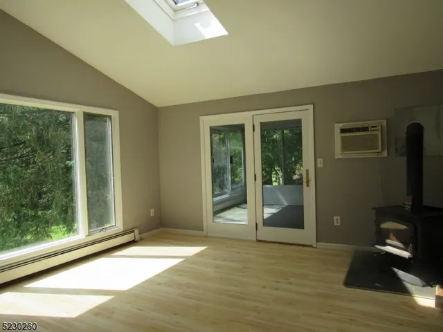 a view of a livingroom with a flat screen tv and glass door