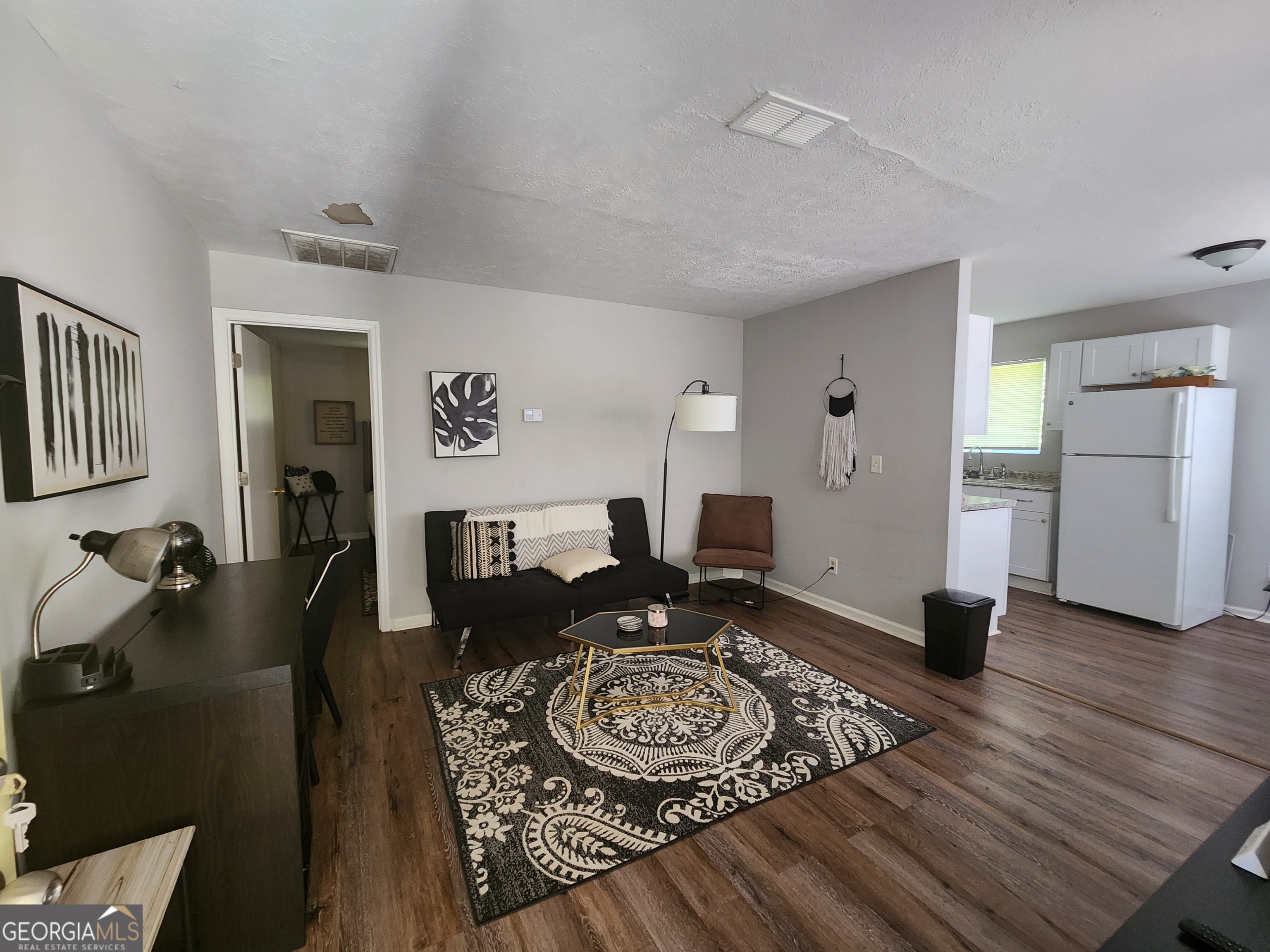 917 Oakview Avenue, Unit D Columbus, GA 31906 - Photo 3 of 13 a living room with furniture and wooden floor