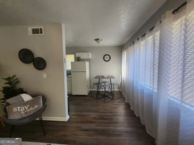 a view of entryway with wooden floor