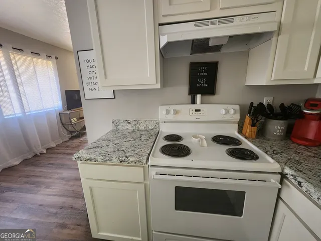 a utility room with sink washer and dryer