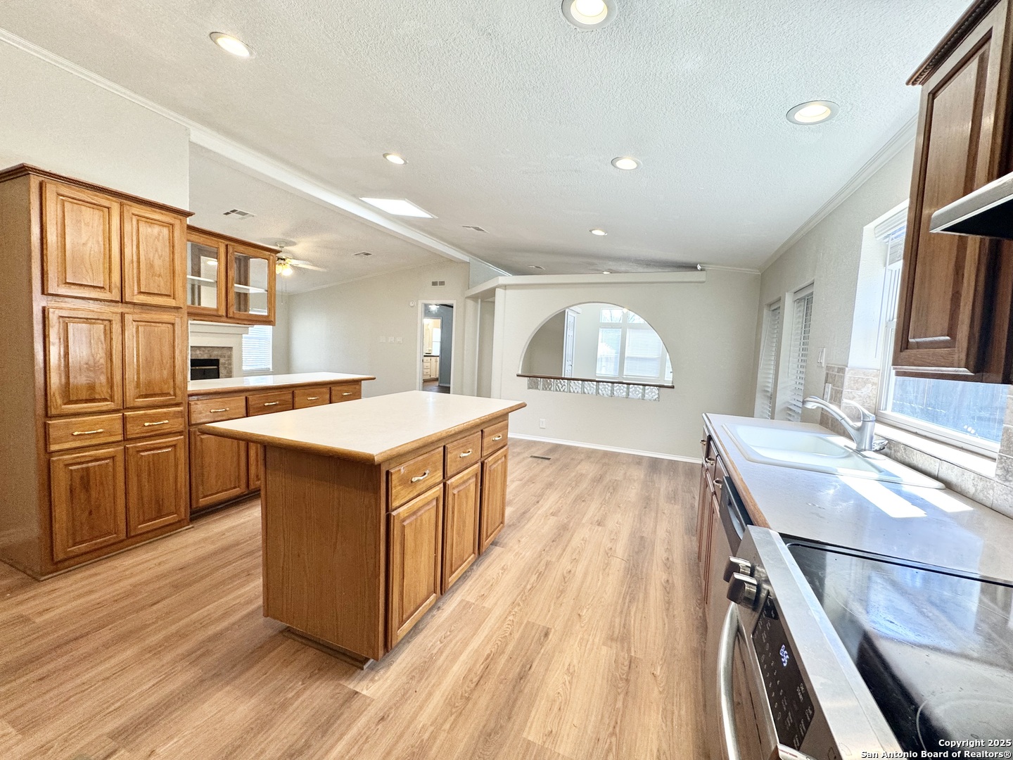 191 Corridor Oaks, Unit 9 Cibolo, TX 78108 - Photo 1 of 18 a large kitchen with stainless steel appliances granite countertop a lot of cabinets and wooden floor
