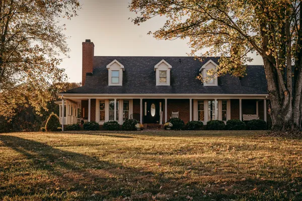 front view of a house with a yard