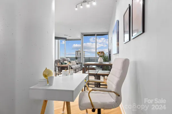 a dining room with furniture and wooden floor