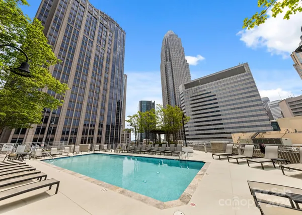 a view of a swimming pool with a lounge chairs