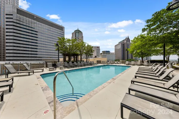 a view of a swimming pool with chairs