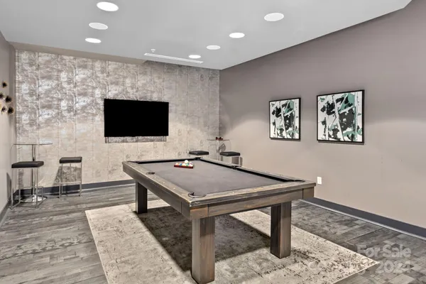 a room with furniture and a flat screen tv