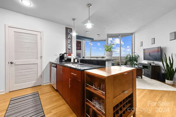 a kitchen with stainless steel appliances granite countertop a stove and a sink